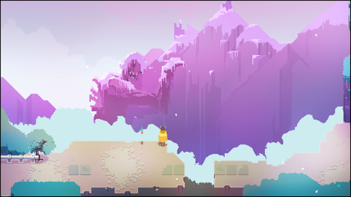 The drifter stands on the edge of a cliff looking into the distance at a giant humanoid skeleton that is leaning against a mountain and is covered in snow and decaying